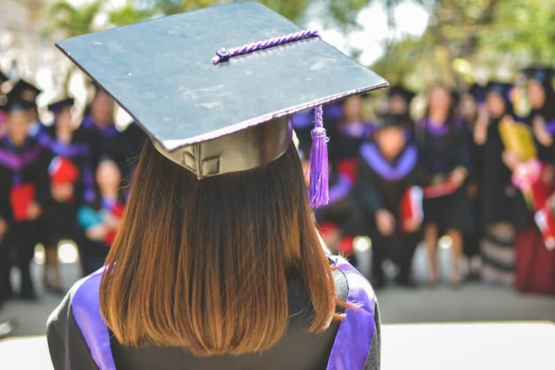 Graduates tossing caps